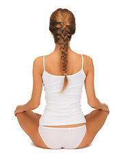Image showing woman in undrewear practicing yoga lotus pose