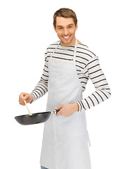 Image showing handsome man with pan and spoon