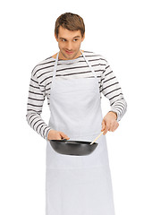 Image showing handsome man with pan and spoon