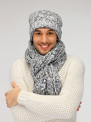 Image showing handsome man in warm sweater, hat and scarf