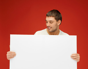 Image showing handsome man with big blank board