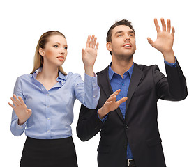 Image showing man and woman working with something imaginary