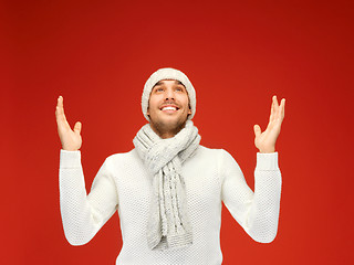 Image showing handsome man in warm sweater, hat and scarf