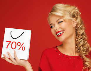 Image showing lovely woman in red dress with shopping bag