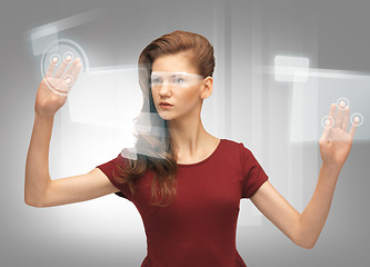 Image showing teenage girl working with virtual screen