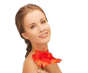 Image showing lovely woman with red lily flower