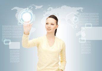 Image showing businesswoman working with touch screen