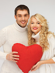 Image showing family couple in a sweaters with heart