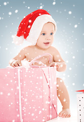 Image showing santa helper baby with christmas gifts