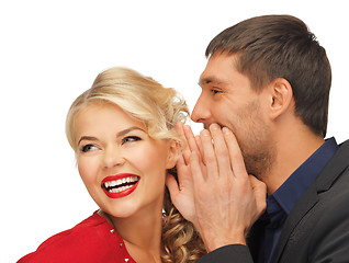 Image showing man and woman spreading gossip