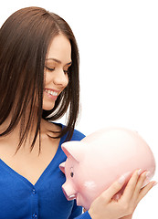 Image showing lovely woman with piggy bank