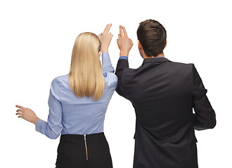 Image showing man and woman working with something imaginary