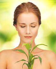 Image showing woman with green sprout