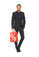 Image showing handsome man in suit with shopping bags