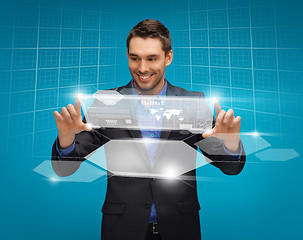 Image showing man in suit working with virtual screens