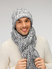 Image showing handsome man in warm sweater, hat and scarf