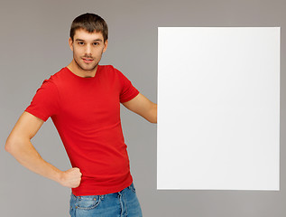 Image showing handsome man with big blank board