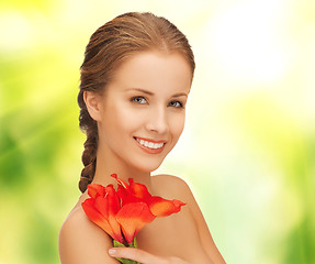 Image showing beautiful woman with red lily flower