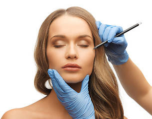 Image showing woman face and beautician hands