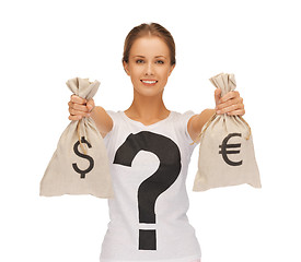 Image showing woman with dollar and euro signed bags