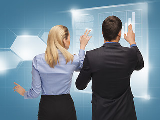 Image showing man and woman working with virtual screens