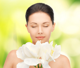Image showing lovely woman with orchid flower