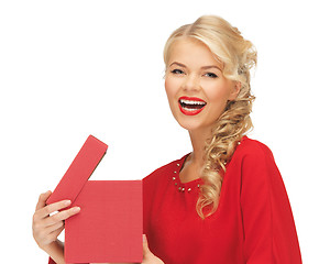 Image showing lovely woman in red dress with opened gift box