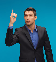 Image showing man in suit with his finger up