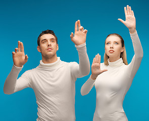 Image showing man and woman working with something imaginary