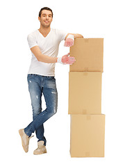 Image showing handsome man with big boxes