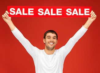 Image showing handsome man with sale sign