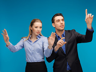 Image showing man and woman working with something imaginary