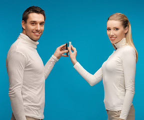 Image showing man and woman with modern gadgets