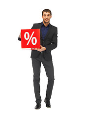 Image showing handsome man in suit with percent sign