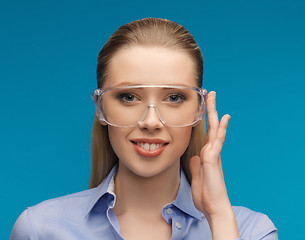 Image showing businesswoman in protective glasses