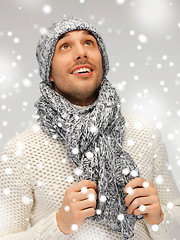 Image showing handsome man in warm sweater, hat and scarf