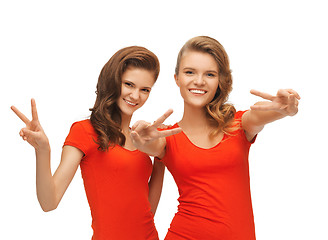Image showing two teenage girls showing victory sign
