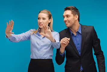 Image showing man and woman working with something imaginary