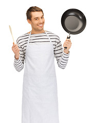 Image showing handsome man with pan and spoon