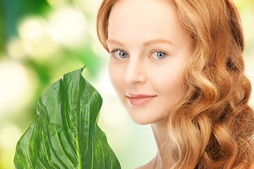 Image showing woman with green leaf