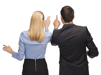 Image showing man and woman working with something imaginary