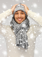 Image showing handsome man in warm sweater, hat and scarf