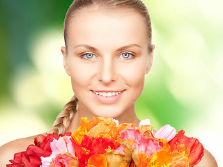 Image showing lovely woman with red flowers