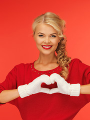 Image showing lovely woman showing heart shape