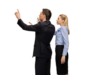 Image showing man and woman working with something imaginary