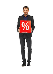 Image showing handsome man in suit with percent sign