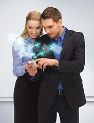 Image showing man and woman reading sms