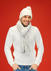 Image showing handsome man in warm sweater, hat and scarf