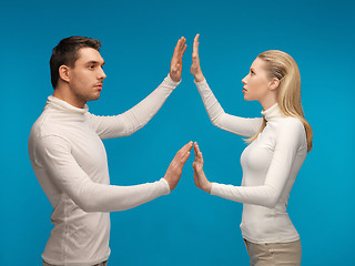 Image showing man and woman working with something imaginary