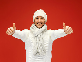 Image showing handsome man in warm sweater, hat and scarf